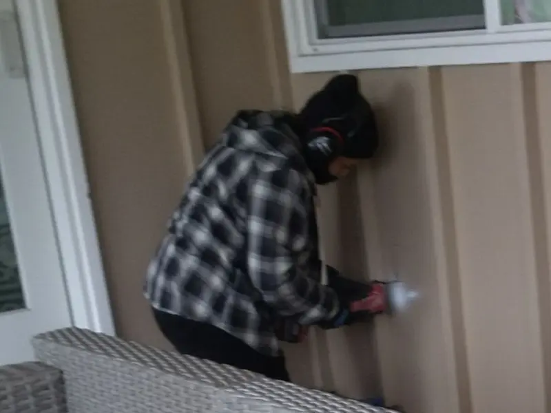 Professional electrician installing an exterior outlet in Short Pump